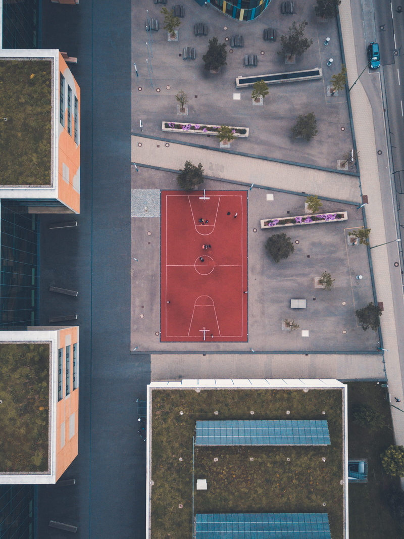 car, architecture, building exterior, pitch, orange, city, glass - material, roof top, window, court, transparent, no people, view, drone view, builting