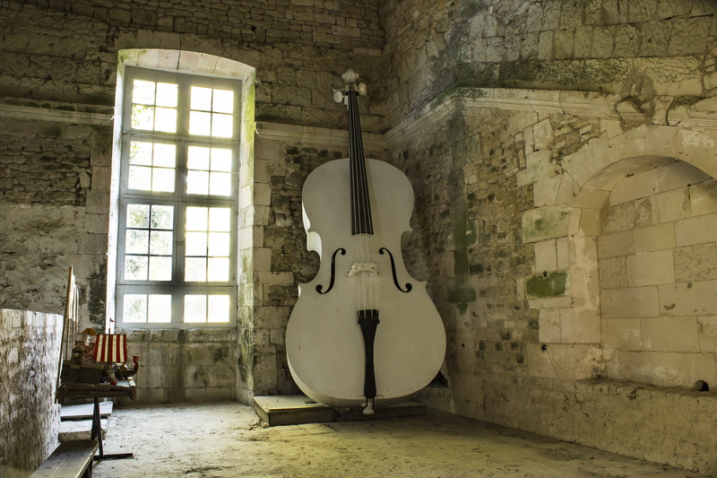 lighting equipment, string instrument, home interior, music, no people, indoors, wall, seat, musical equipment, wall - building feature, old, built structure