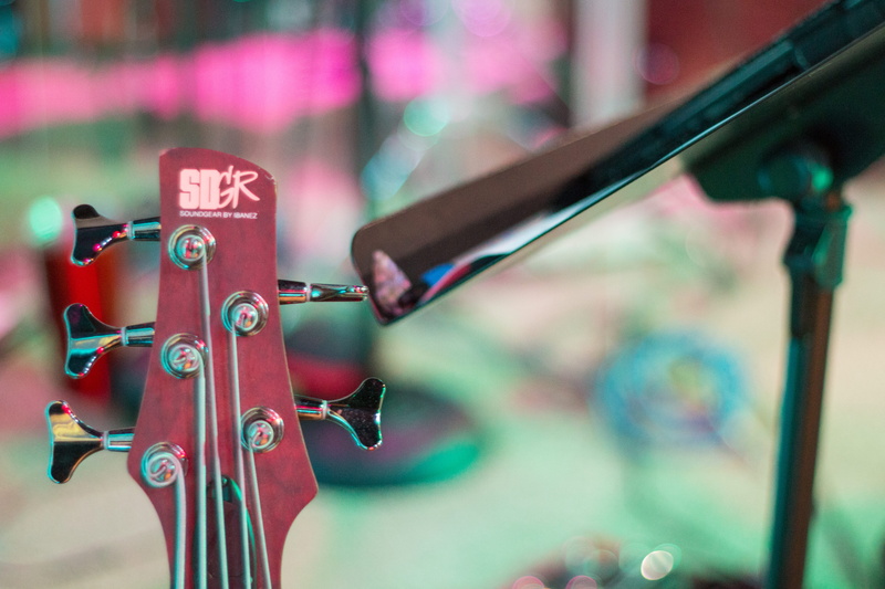 absence, no people, 5K, day, close-up, outdoors, land vehicle, musician, red, focus on foreground, guitar, text, equipment, church, bass, strings, metal