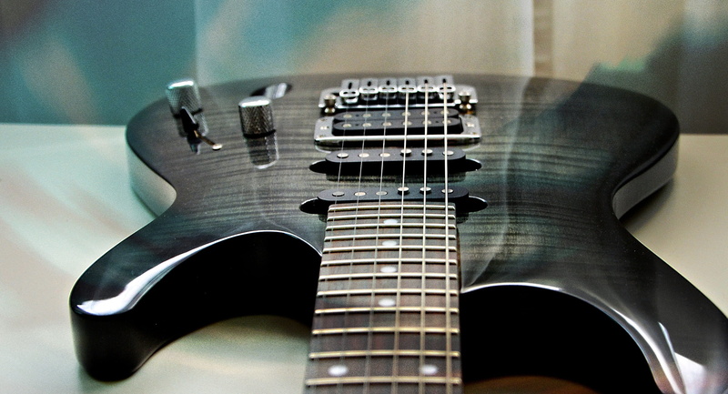 indoors, musical instrument string, stringed instrument, close-up, electric, musical equipment, table, still life, bass instrument, rock guitar, detail