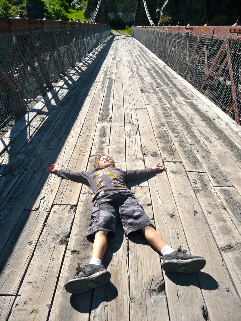 human arm, sleeping, high angle view, reluctant, kid, boy, boys, full length, nature, defiant, men, leisure activity, rural, eerie, tired, bridge, one person