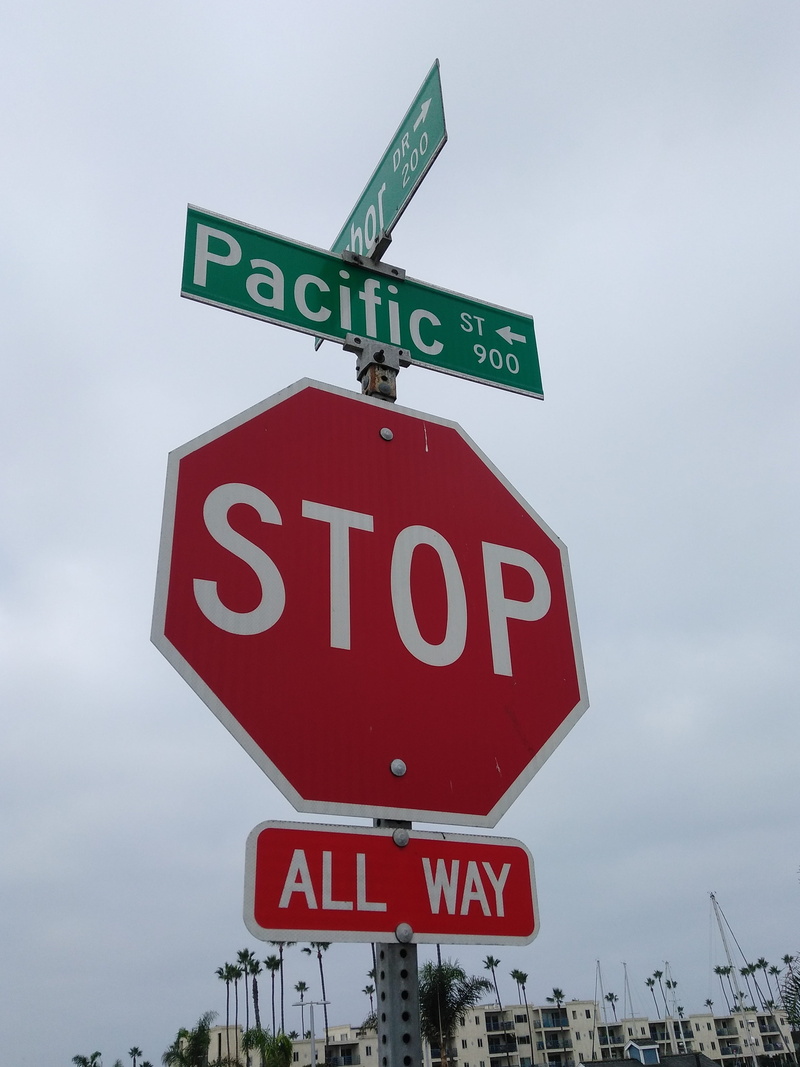 arrow symbol, road sign, sign, information, street, no people, transportation, design, signal, communication, low angle view, capital letter, directional sign