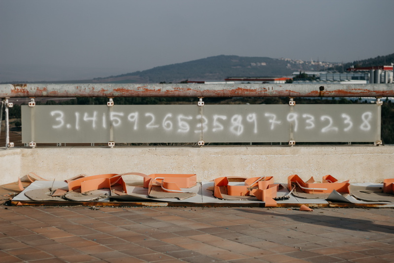 building exterior, no people, nature, built structure, grafitti, graffiti, dovrat, number, clear sky, label, mountain, pi, sky, math, chill, seat, day