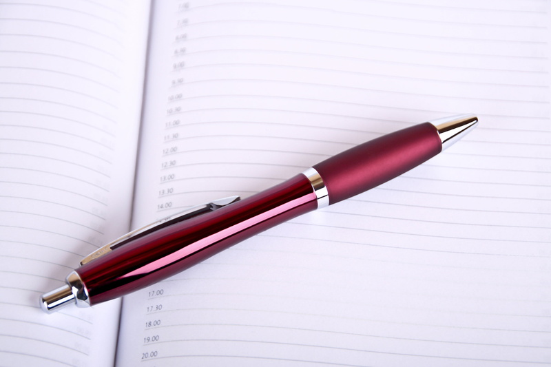 education, note pad, schedule, appointment, red, still life, indoors, calendar, ballpoint pen, leave, table, publication, writing, ruled, two objects, fountain pen