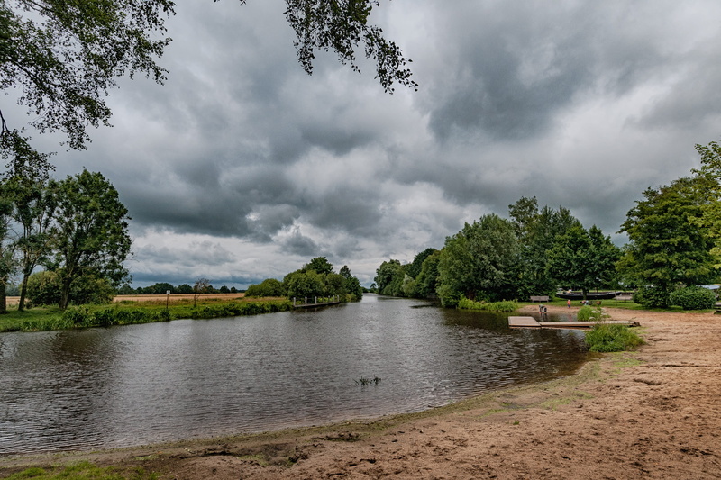 cloud - sky, dark clouds, neu-helgoland, beauty in nature, environment, clouds, river, beach, worpswede, tree, no people, landscape, nature, land, tranquility