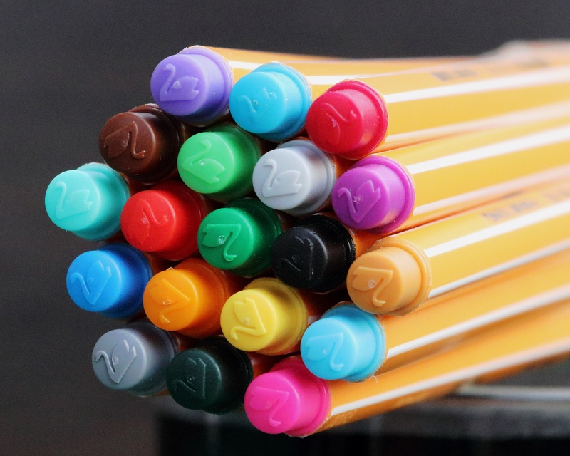 large group of objects, paint, choice, felt tip pens, leave, table, plastic, draw, design, multi colored, character device, still life, collection, no people