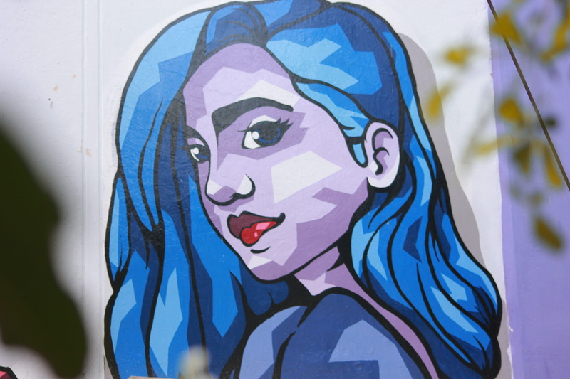 focus on foreground, mask, headshot, craft, woman, surakarta, painted, modern, wall, painted image, 5K, blue, indonesia, multi colored, art and craft