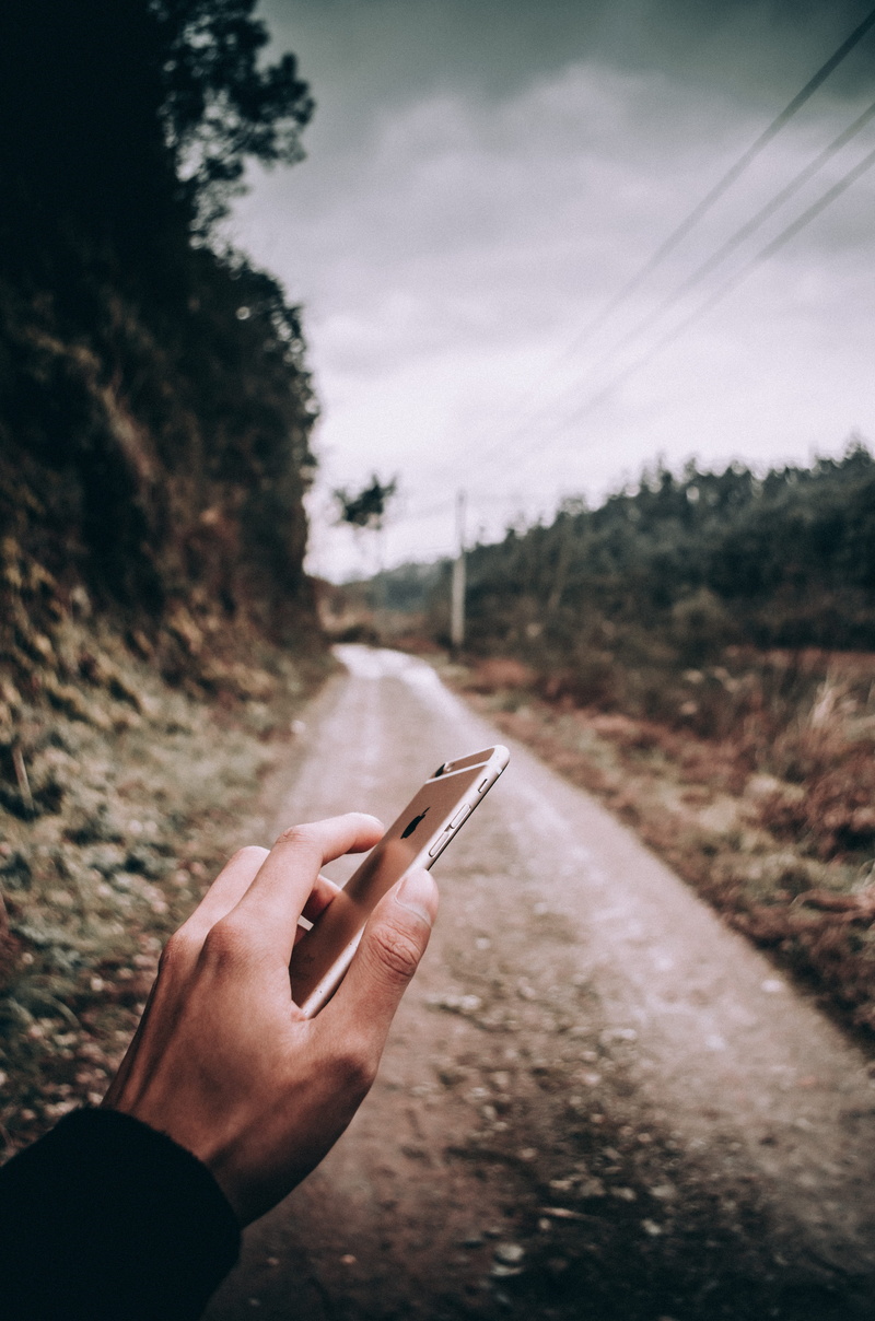 mobile phone, coat, tree, ground, 4K, apparel, rubble, clothing, cloud - sky, human, hand-held computer, transportation, day, human hand, sky, gravel