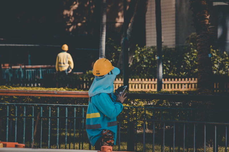 standing, architecture, hardhat, railing, performer, outdoor play equipment, hat, child, fence, childhood, lifestyles, innocence, steeple, near, sun hat
