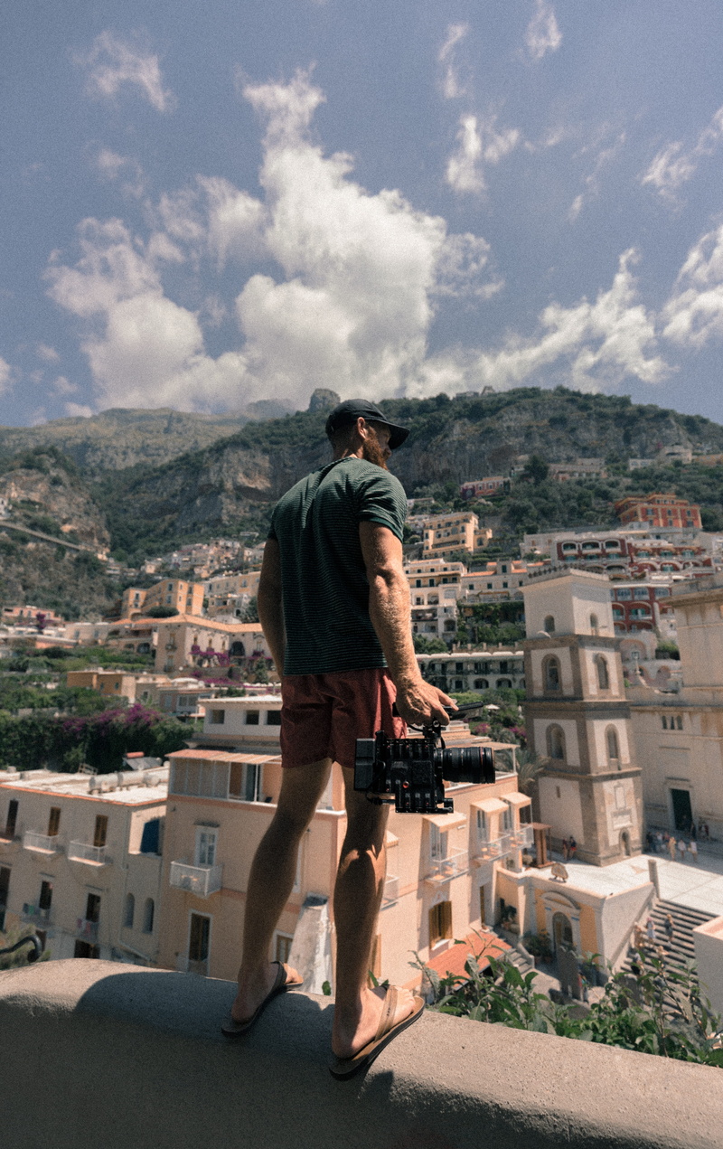townscape, canon photography, residential district, man, city, camera, hillside, building, wall, buildings, outdoors, muscle, film gear, full length, landscape