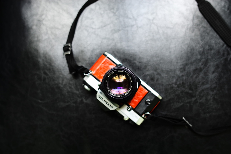 directly above, milc, security, indoors, still life, no people, camera, high angle view, technology, olympus, orange, lens, communication, black color