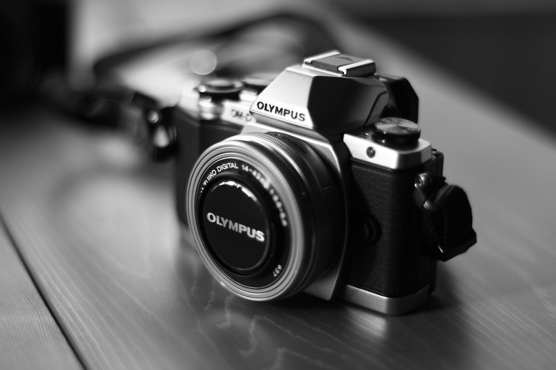 close-up, digital camera, black color, activity, photographing, gray, surface, lens - eye, black and white, milc, brown, still life, black, indoors, table