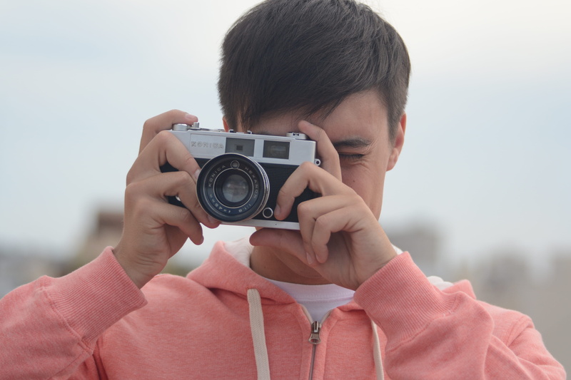 real people, vintage, camera - photographic equipment, portrait, leisure activity, holding, pink, cute, photographer, activity, men, photography, focus on foreground