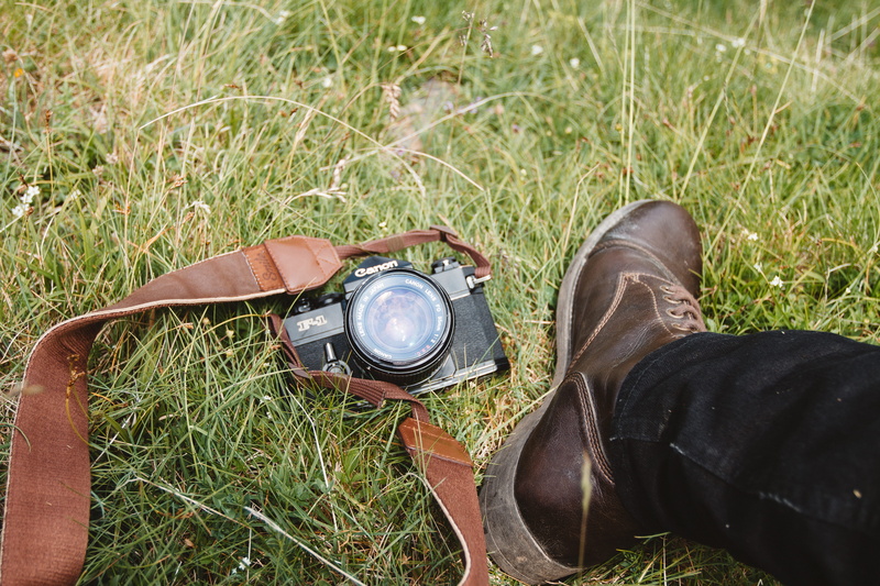 high angle view, human foot, plant, old-fashioned, outdoors, shoe, one person, personal perspective, human body part, green color, grass, Canon F1, lifestyles