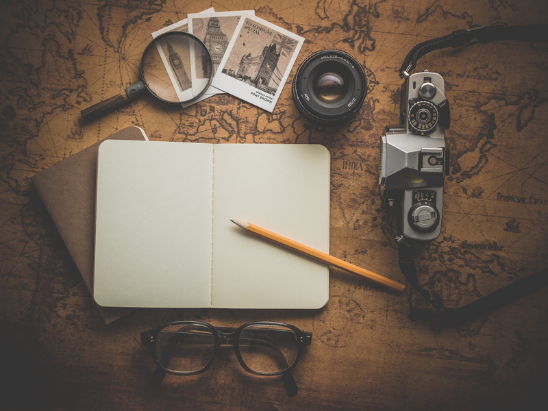 indoors, trip, fountain pen, map, near, camera, antique, table, high angle view, no people, paper, glasses, technology, eyewear, publication, group of objects