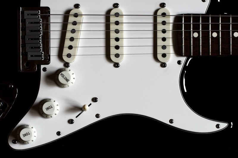 musical instrument, guitar, music, close-up, rock music, equipment, black background, arts culture and entertainment, indoors, studio shot, fender, electrical equipment
