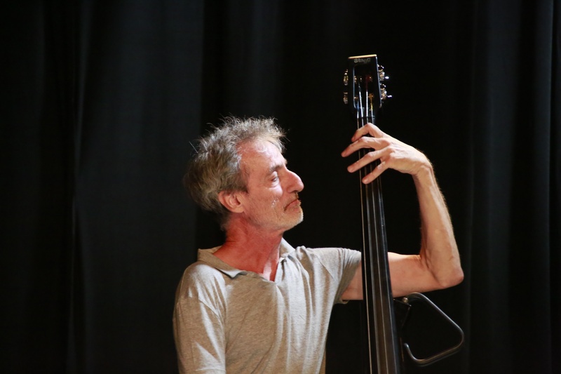 performance, lifestyles, indoors, holding, one person, men, black background, bass, musician, adult, musical instrument, waist up, mature adult, headshot