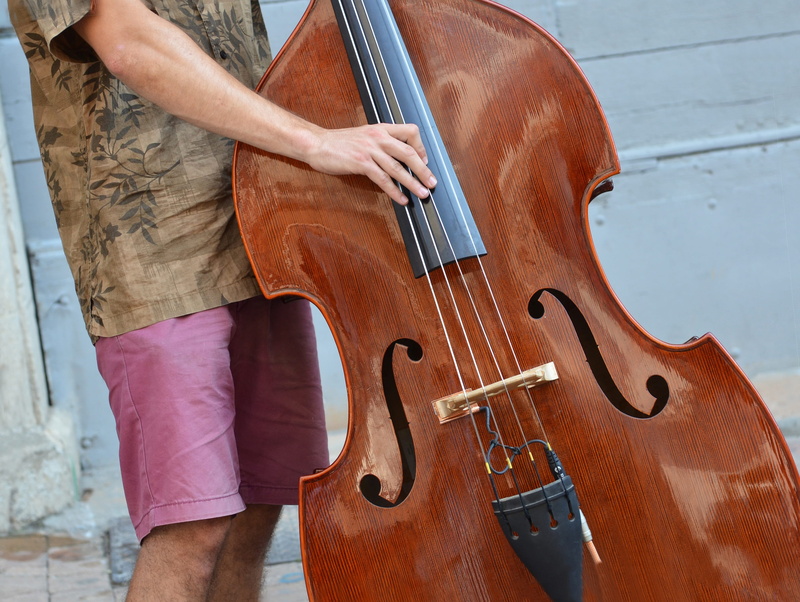day, holding, music, skill, bow - musical equipment, artist, wood - material, real people, 2K, human body part, casual clothing, string instrument, one person