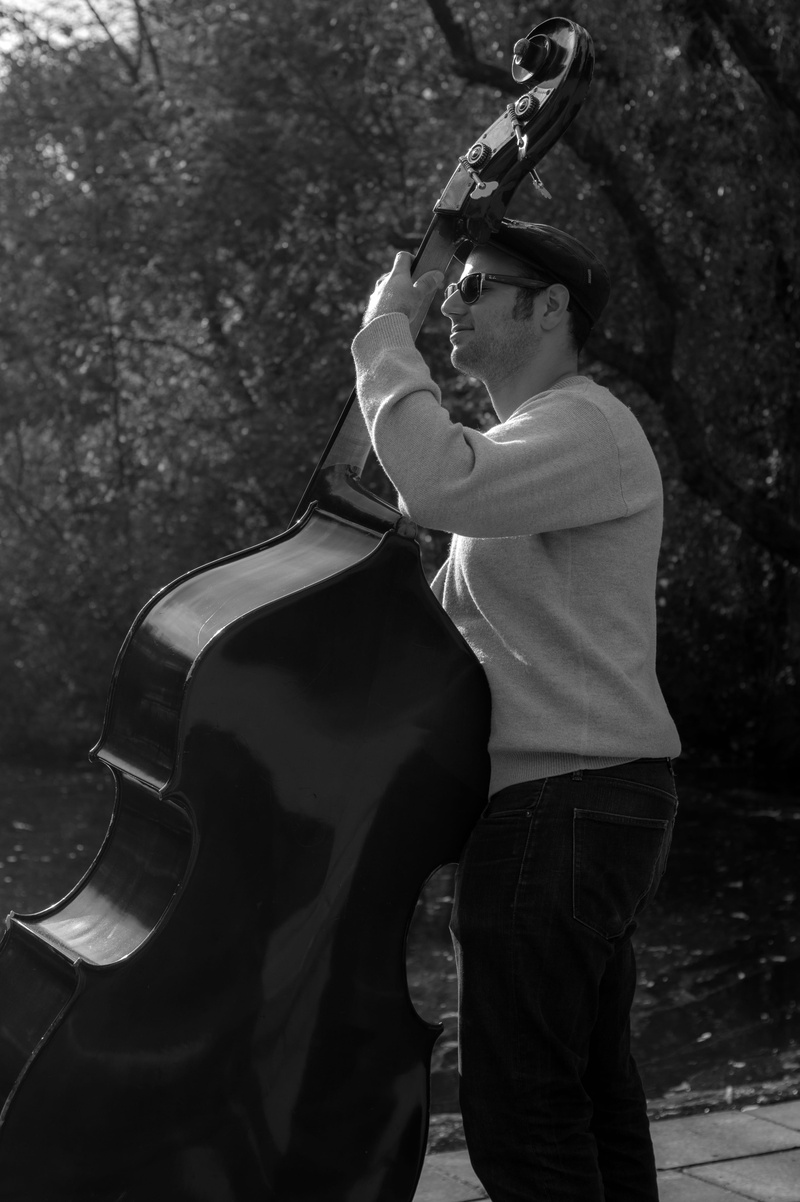 man, lifestyles, musical instrument string, cello, holding, tree, leisure activity, music, musical equipment, photography, music player, black-and-white