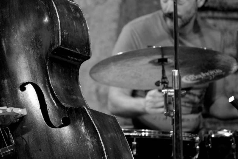 playing, jazz, indoors, photo, lectern, string instrument, arts culture and entertainment, holding, midsection, classical music, artist, skill, creativity