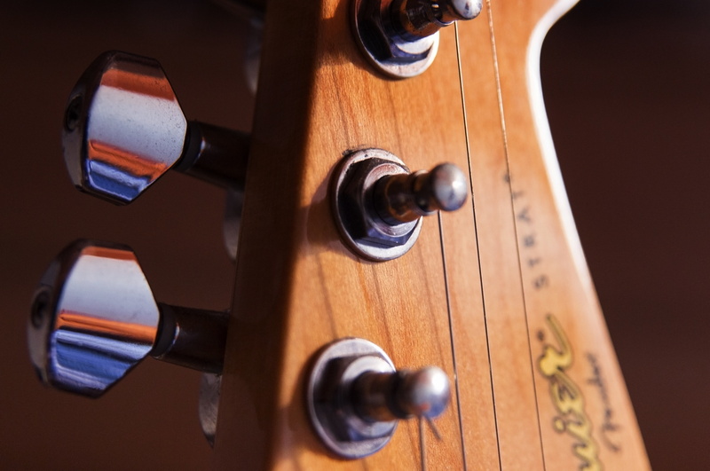 musical equipment, creativity, single object, brown, colored background, squier, keys, tool, electric, music, still life, violin, no people, close-up, wood - material