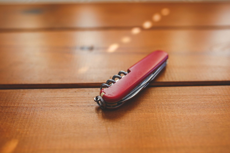 wood, table, wood grain, choice, desk, still life, personal accessory, technology, knife, penknife, brown, close-up, day, musical instrument, no people