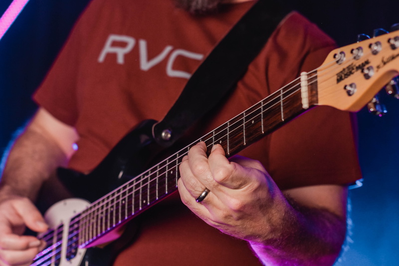 musical instrument, human, stage, electric guitar, event, pop musician, nightlife, leisure activities, artist, guitarist, string instrument, people, human hand