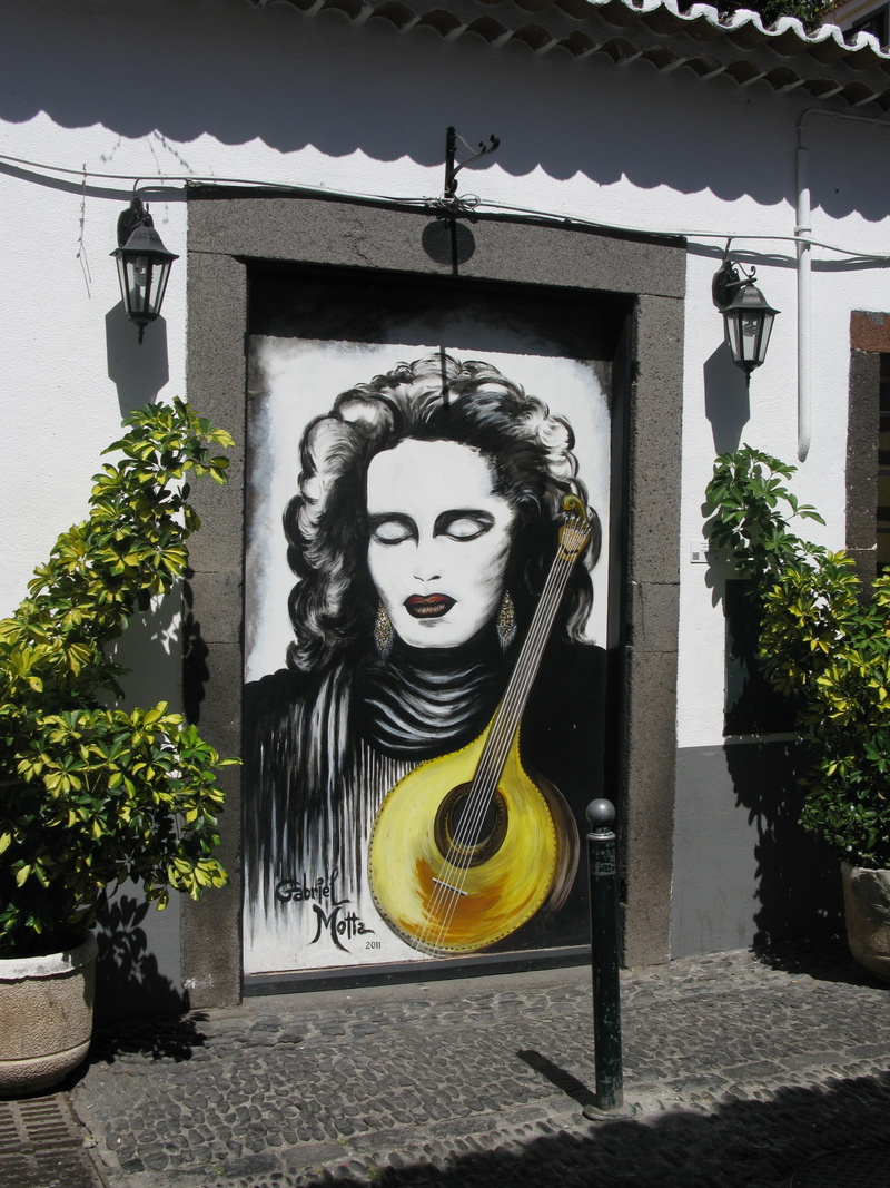 craft, door, human representation, spooky, front view, Madeira, art and craft, day, sculpture, outdoors, nature, Painting, male likeness, building exterior
