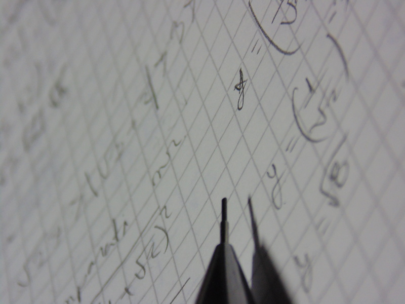 focus on background, shadow, wall - building feature, safety, graphing, no people, low angle view, math notebook, security, paper, pattern, still life