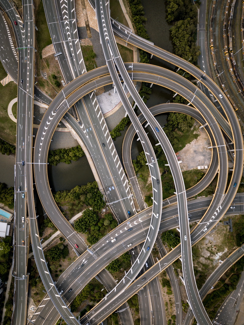 city, traffic, curve, elevated road, highway, built structure, modern, high angle view, intersection, concrete, machine, multiple lane highway, transportation