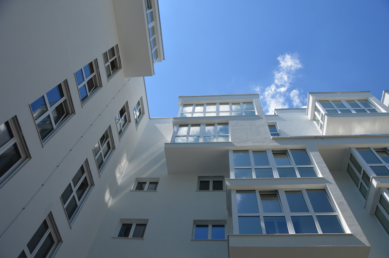 building, cloud - sky, apartment, town home, day, downtown, window, mirroring, sunlight, outdoors, roofs, white, sky, white color, building exterior, live and work