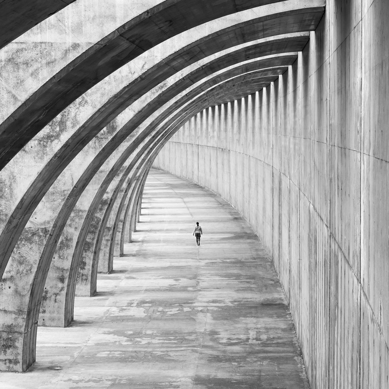 indoors, in a row, space, architectural column, fractals, lifestyles, colonnade, the way forward, architecture, day, gallery, endeavor, real people, footpath