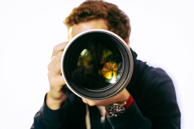 obscured face, knitting, photography themes, front view, black, camera - photographic equipment, photographing, wearing, khaki, camera lens, photography