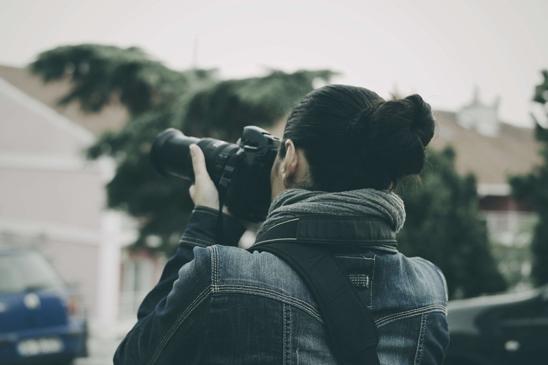 woman, casual clothing, lifestyles, one person, technology, holding, standing, 4K, adult, activity, digital camera, paparazzi, reporter, rear view, focus on foreground