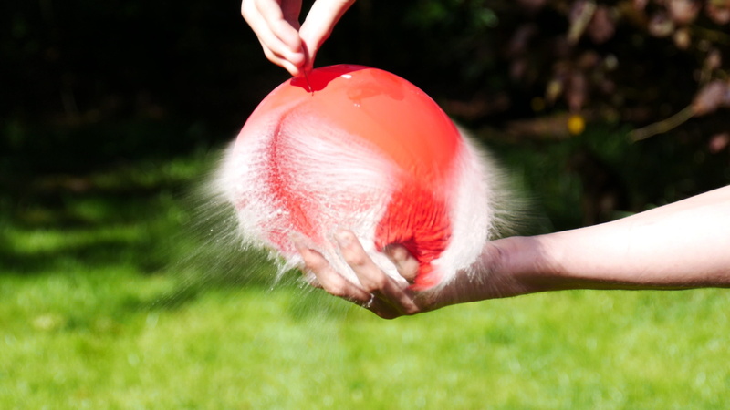 human body part, 4K, adult, garden, burst, grass, human hand, holding, puncture, offspring, high-speed recording, body part, moist, day, water, finger