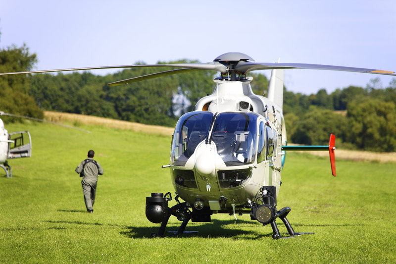 police, green color, flying machine, men, sky, full length, flight, newcomer, people, helicopter, grass, fly, nature, taxes, air vehicle, aircraft, airplane