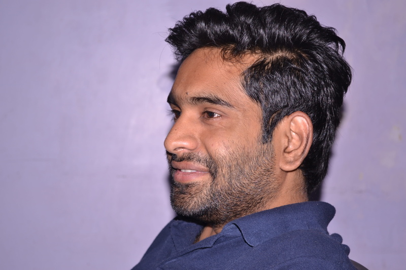 happiness, studio shot, black hair, expression, hair, men, india, young adult, indoors, owner, headshot, young, one person, wall - building feature, portrait