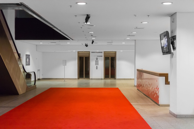 illuminated, empty, lobby, ceiling, corridor, red carpet, hall, architecture, office, wealth, clean, flooring, red, arcade, entrance, lighting equipment