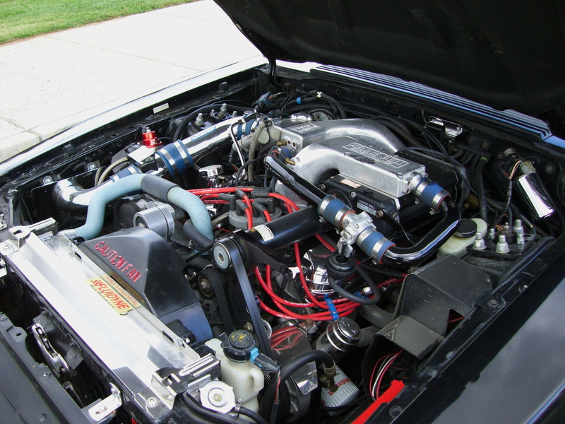 high angle view, outdoors, ford, control panel, gear, silver colored, fast, technology, 2K, injection, no people, charger, classic, engine, metal, close-up