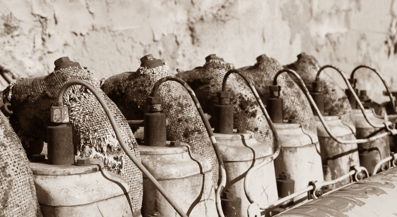 history, outdoors, wall - building feature, representation, day, close-up, in a row, focus on foreground, side by side, cylinder, spirituality, the past