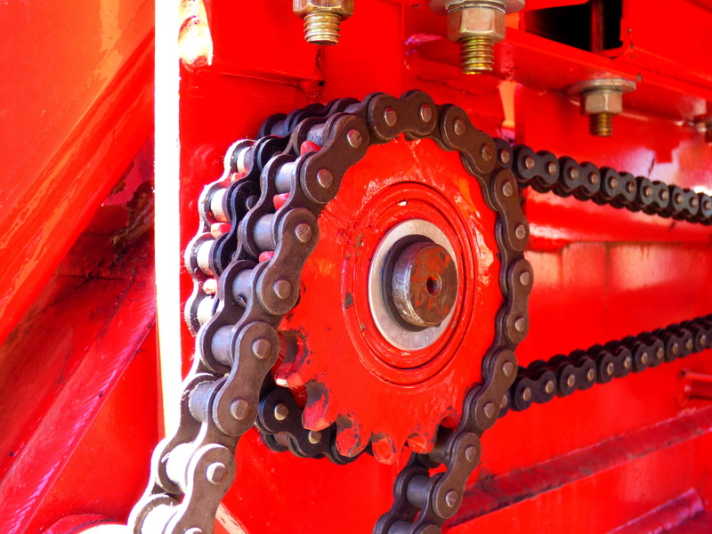 close-up, red, truck, sunlight, wheel, connection, machine part, industry, tire, mode of transportation, outdoors, land vehicle, transportation, chains