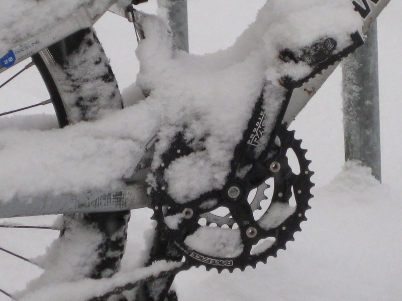 land vehicle, bicycle, Mountain Bike, outdoors, snow, architecture, bike, wheel, 2K, high angle view, day, circuit, frozen, snowing, white color, transportation
