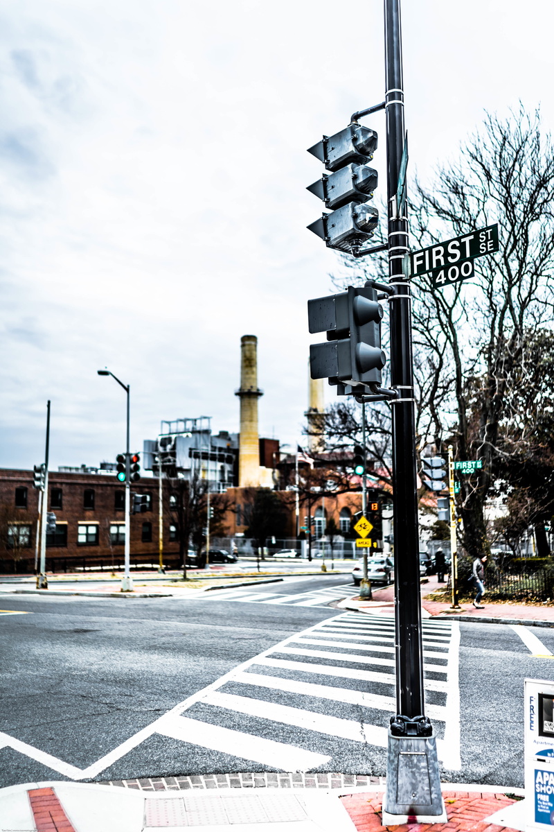 stoplight, sign, city life, pedestrian, transportation, marking, traffic, street, nature, built structure, road marking, crossing, tower, lane, road sign