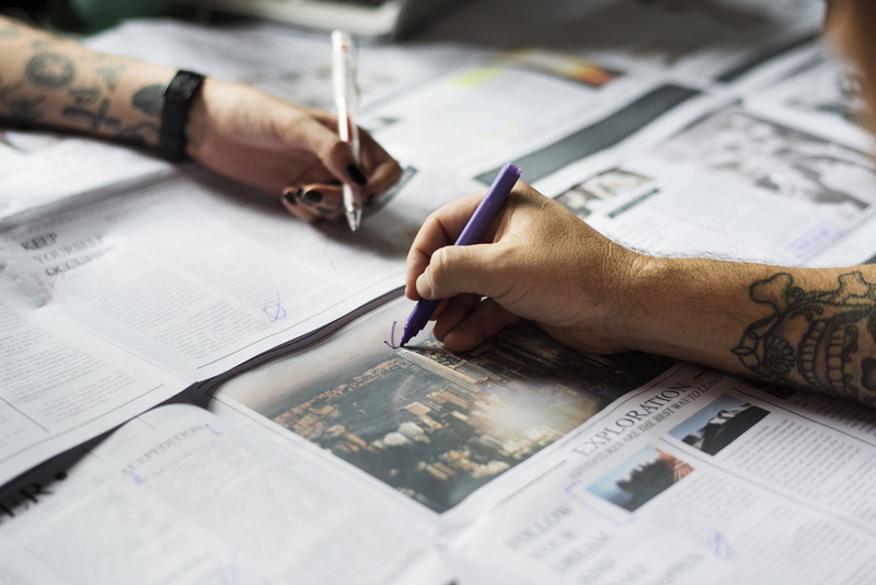 planning, document, design professional, hand, news, business, blur, table, tattoos, close-up, writing, indoors, one person, men, human hand, paper, human body part