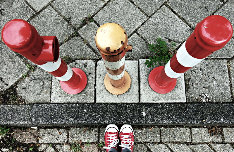 safety barrier, directly above, human body part, day, curb, human leg, low section, footpath, high angle view, standing, sidewalk, red white barrier, concrete