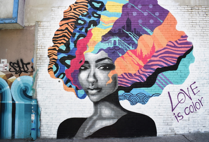 female likeness, multi colored, representation, portrait, one person, wall art, text, print, graffiti, front view, creativity, headshot, color, purple
