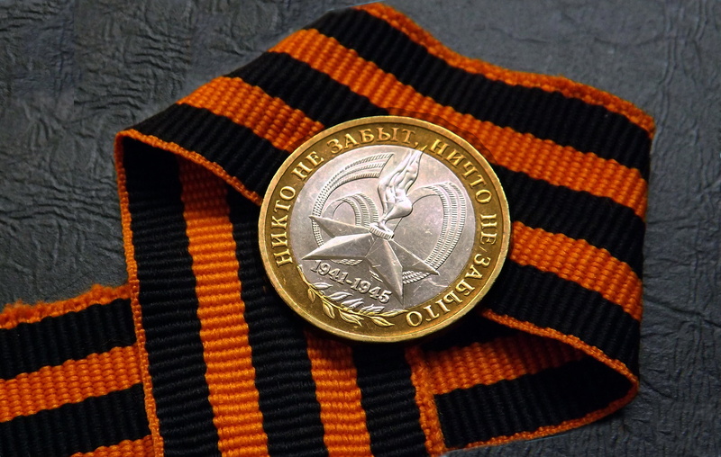 finance, FIRE, MEMORY, still life, textile, indoors, GEORGE, HISTORY, design, metal, silver colored, number, gold colored, STAR, orange color, close-up