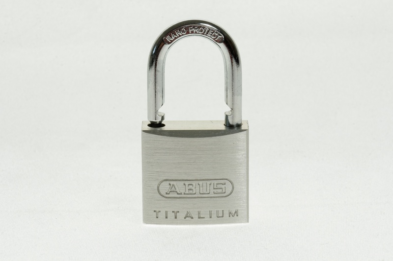 close-up, sign, white background, indoors, entrance, security, locks to, security lock, number, safety, single object, sure, capping, shut off, arch, theft protection