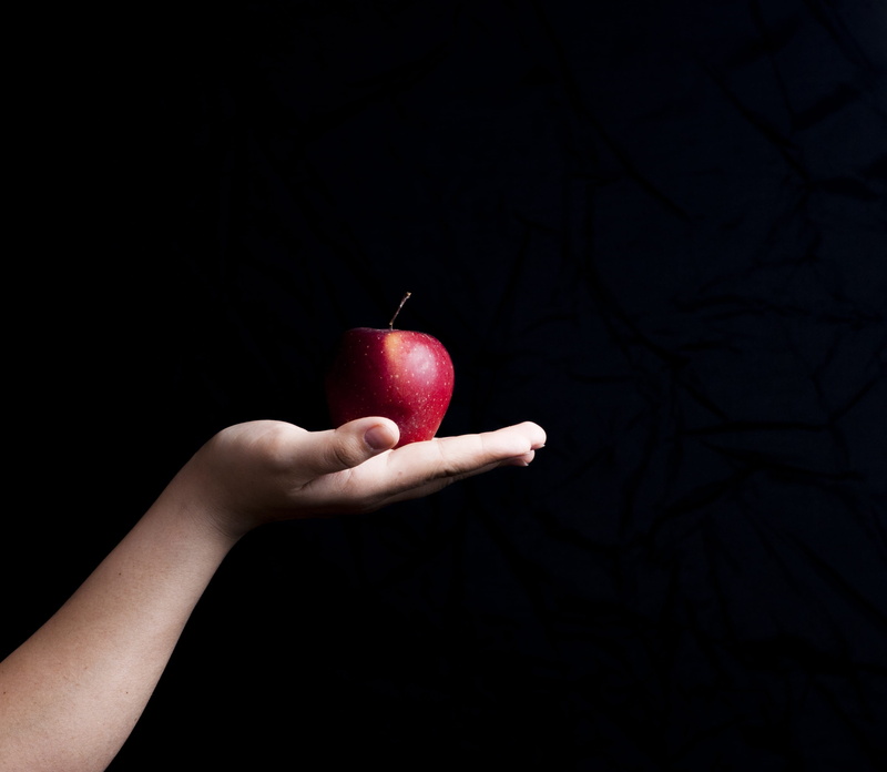 black background, person, wellbeing, hand, 2K, red apple, lifestyles, food, one person, human hand, indoors, administration, princess, palm, freshness