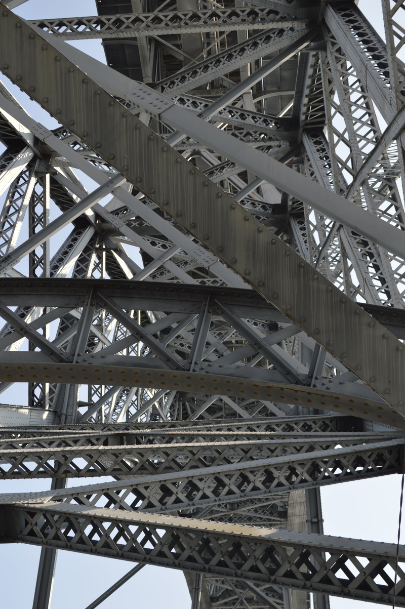 strength, city, low angle view, travel destinations, complicated, day, tubing, bridge, built structure, outdoors, postage, no people, steel, travel, metal